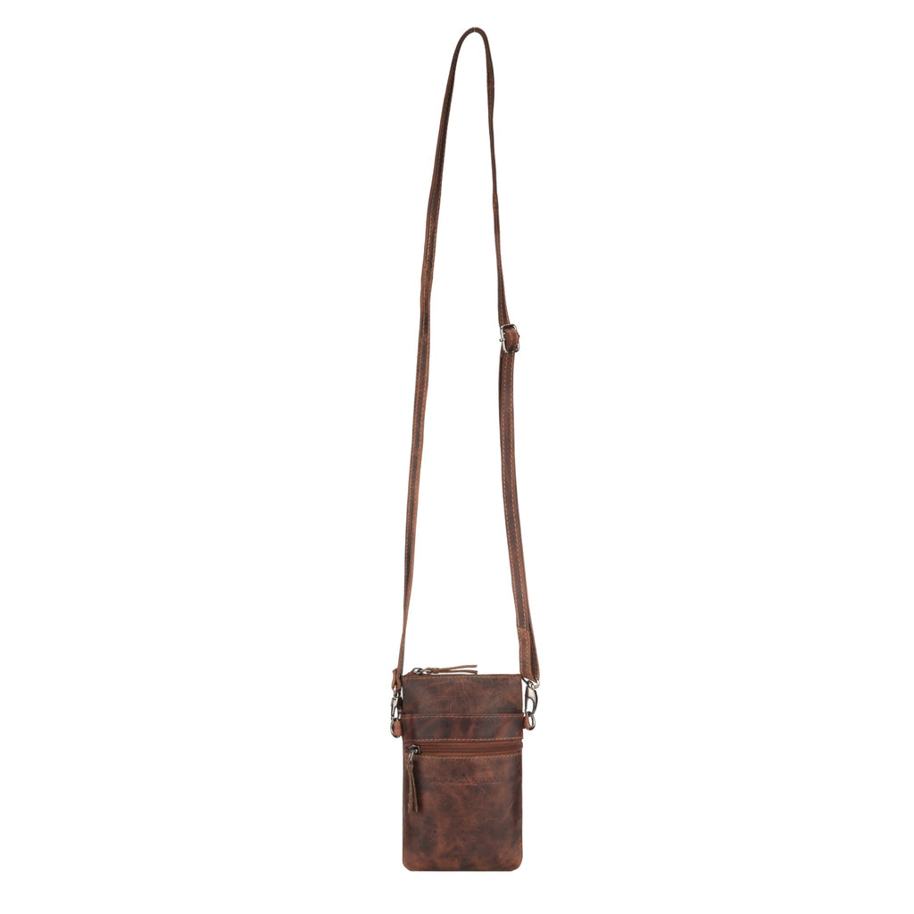 Minori Leather Ashford unisex leather sling bag in chestnut with adjustable strap and compact design for daily use.