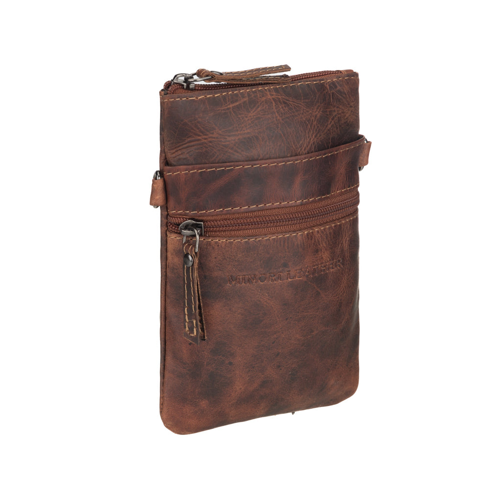 Minori Leather Ashford unisex chestnut leather sling bag with adjustable strap and minimalist design.
