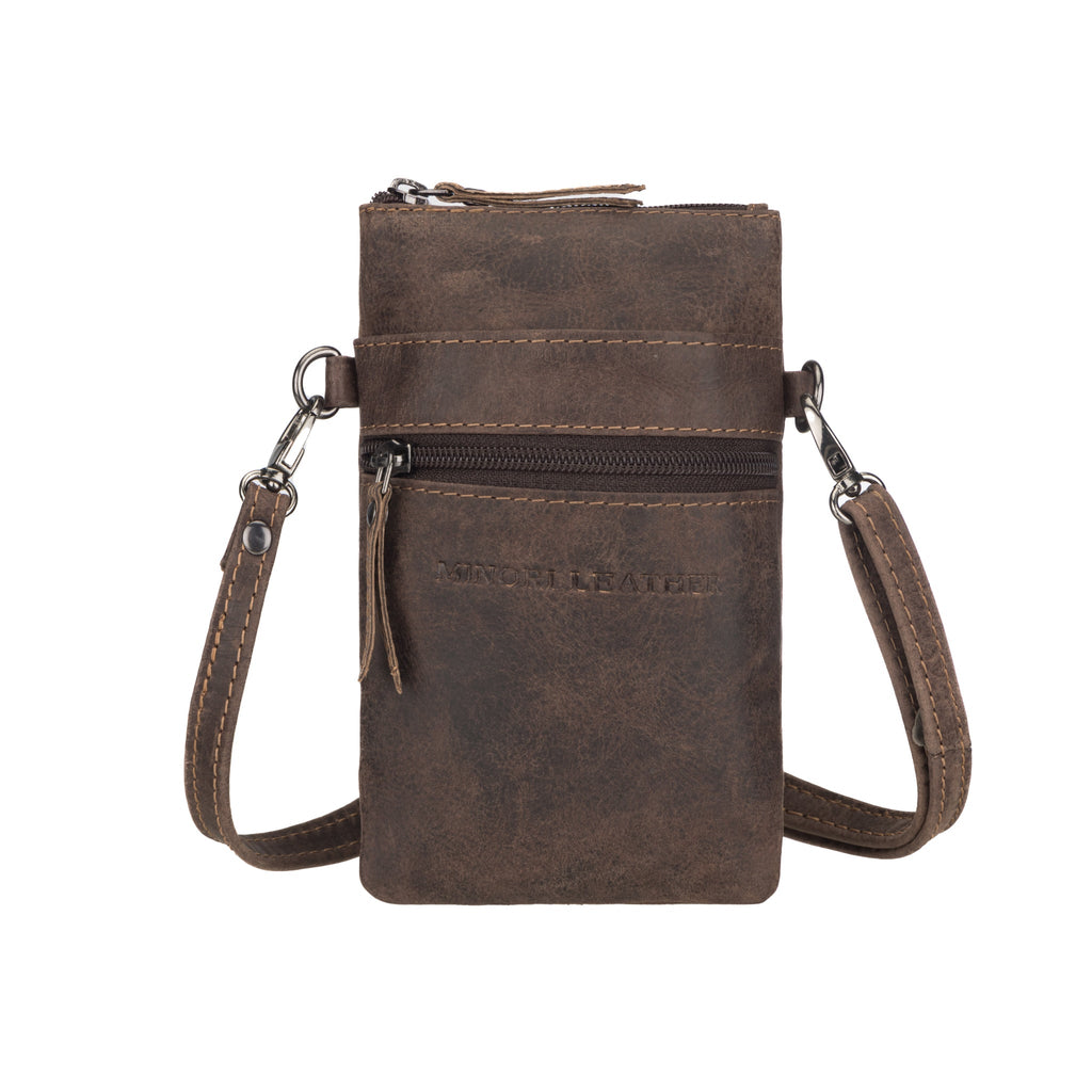 Brown Minori Leather Ashford sling bag for unisex use, featuring leather construction and adjustable strap.