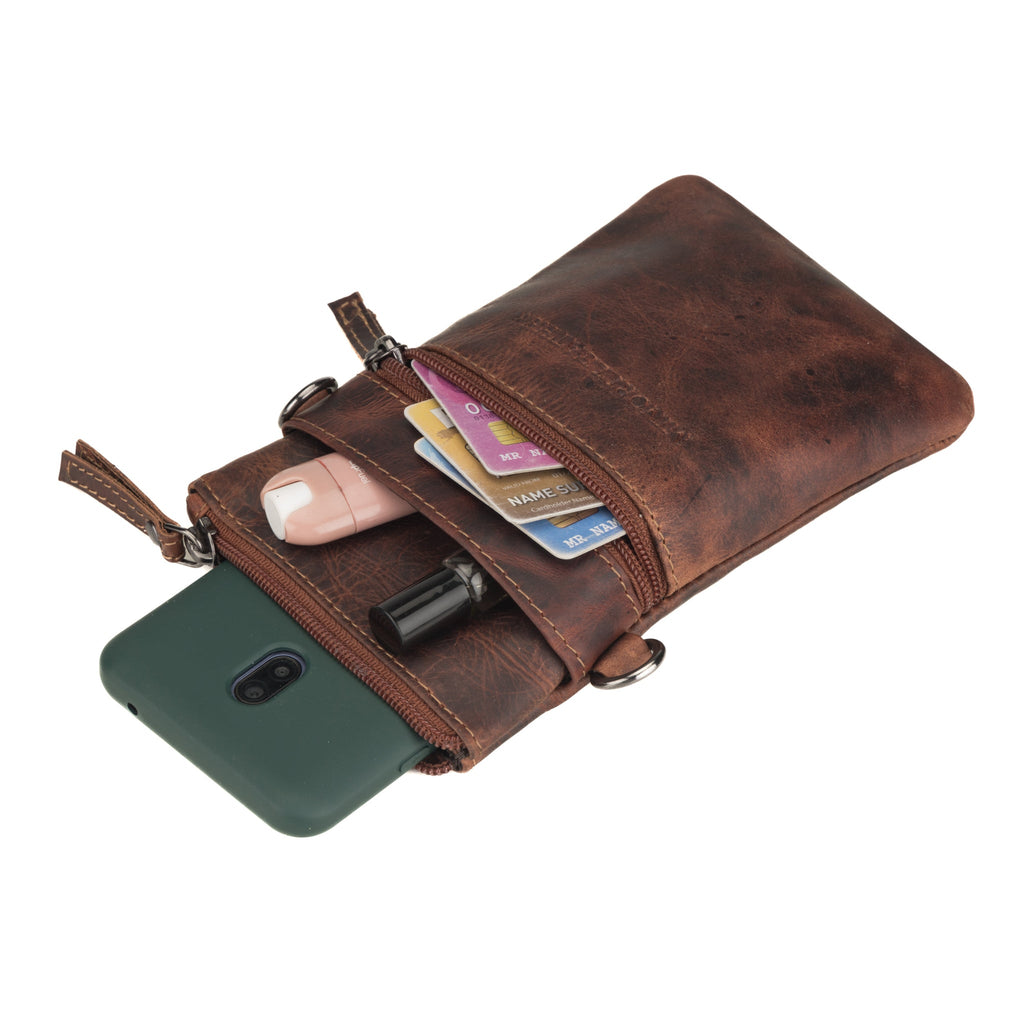 Minori Leather Ashford leather sling bag in chestnut, unisex design with adjustable strap and compact, stylish appearance.