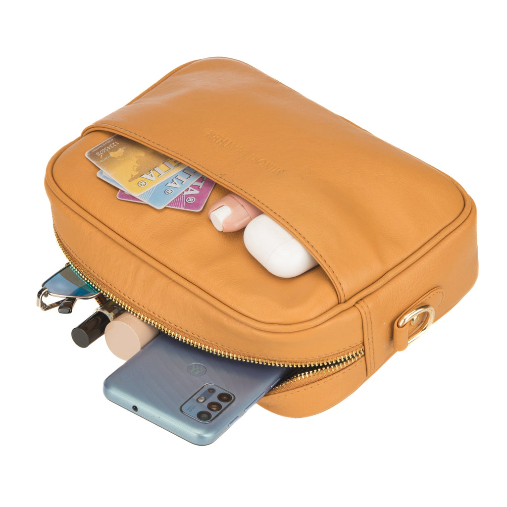 Tan Evelyn leather crossbody bag for women by Minori Leather, featuring a sleek design and adjustable strap.