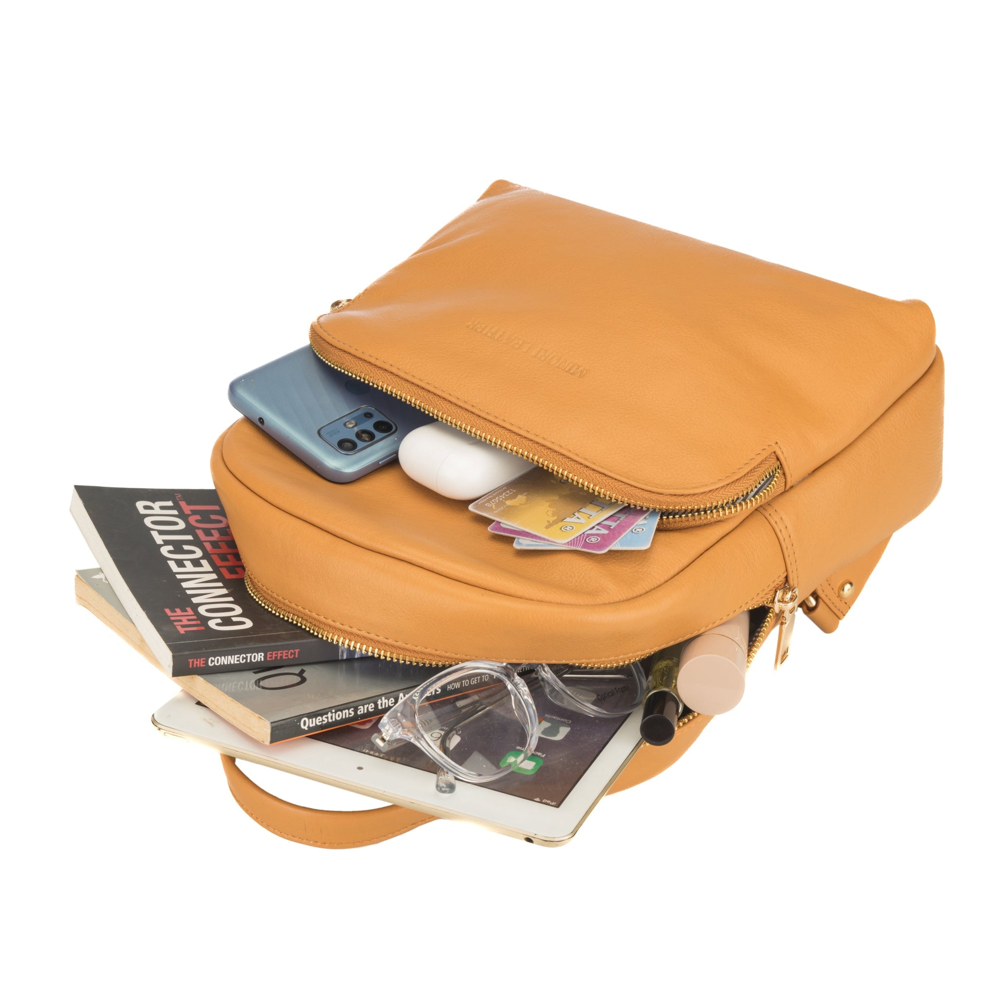 Tan Madison leather backpack for women by Minori Leather, featuring a stylish and functional design with adjustable straps and spacious interior.