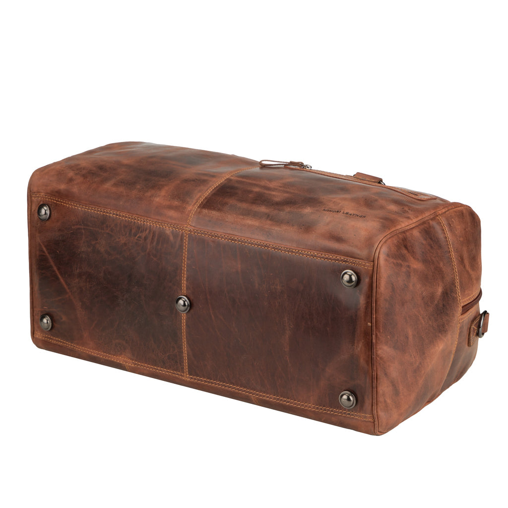 Minori Leather Hudson leather duffle bag in chestnut, unisex design with sturdy handles and spacious interior.