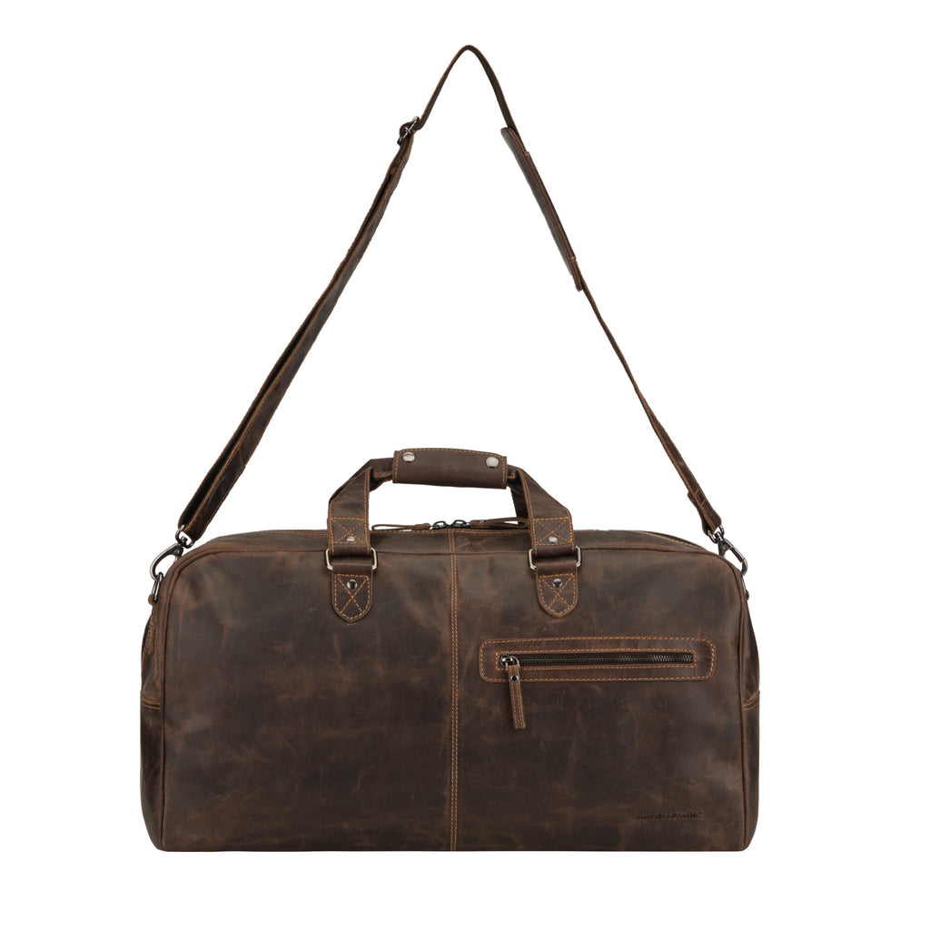 Brown Minori Leather Hudson leather duffle bag for men and women, featuring sturdy handles and spacious design.