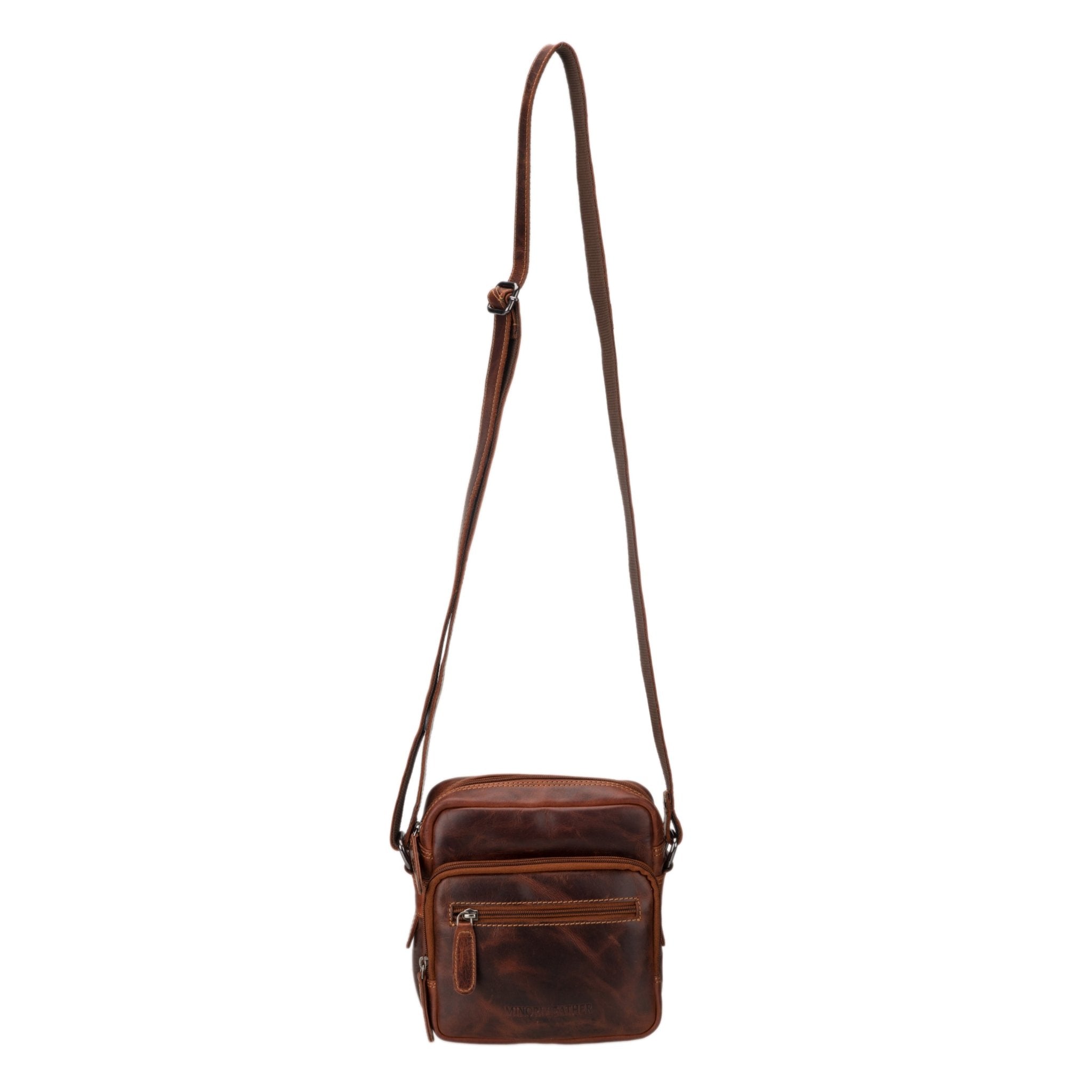 Minori Leather Cove Leather Crossbody Bag in Chestnut with adjustable strap and sleek design, showcasing high-quality leather craftsmanship.