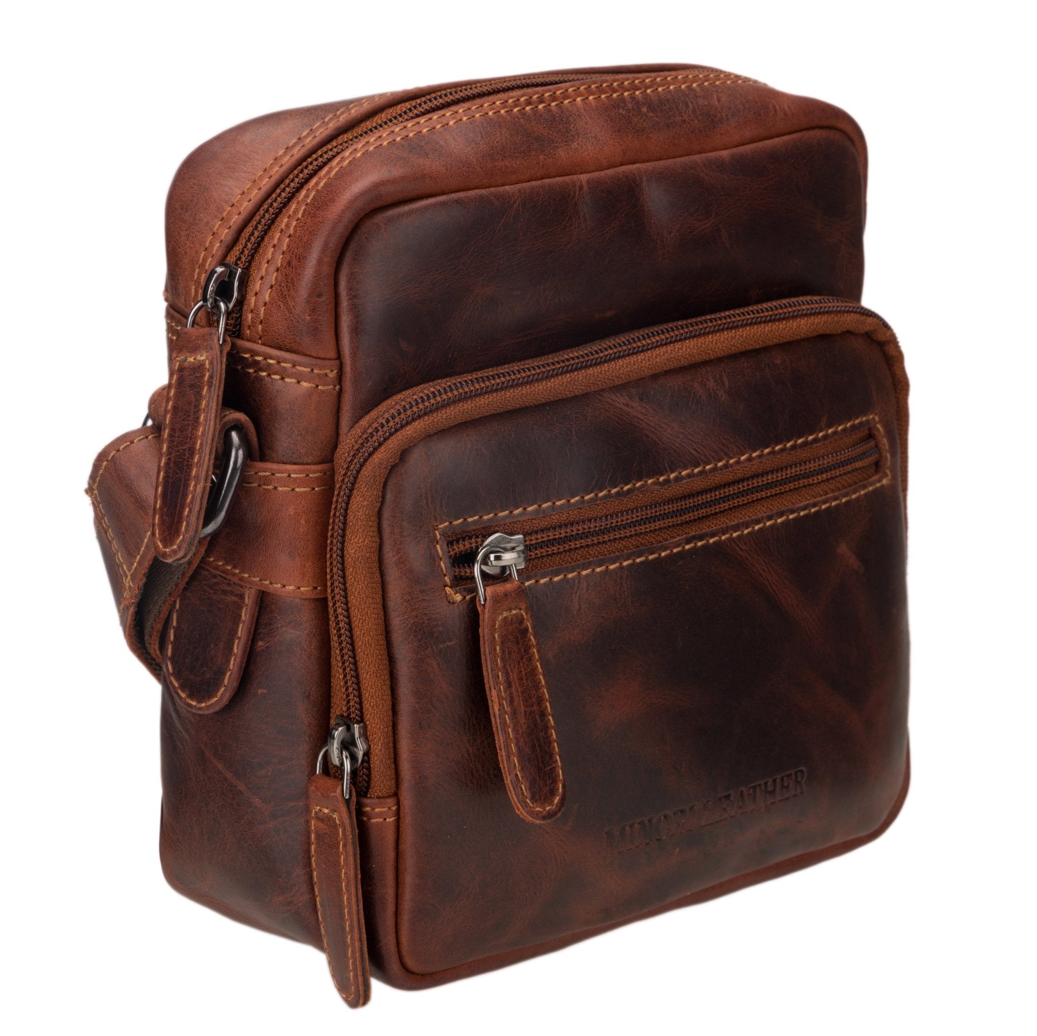 Minori Leather Cove crossbody bag in chestnut leather with adjustable strap and compact design.