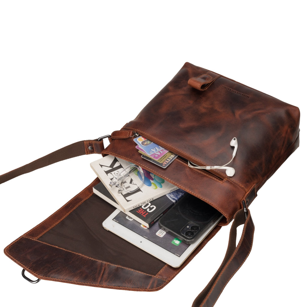Minori Leather Noah chestnut leather crossbody satchel bag with adjustable strap and sleek design.