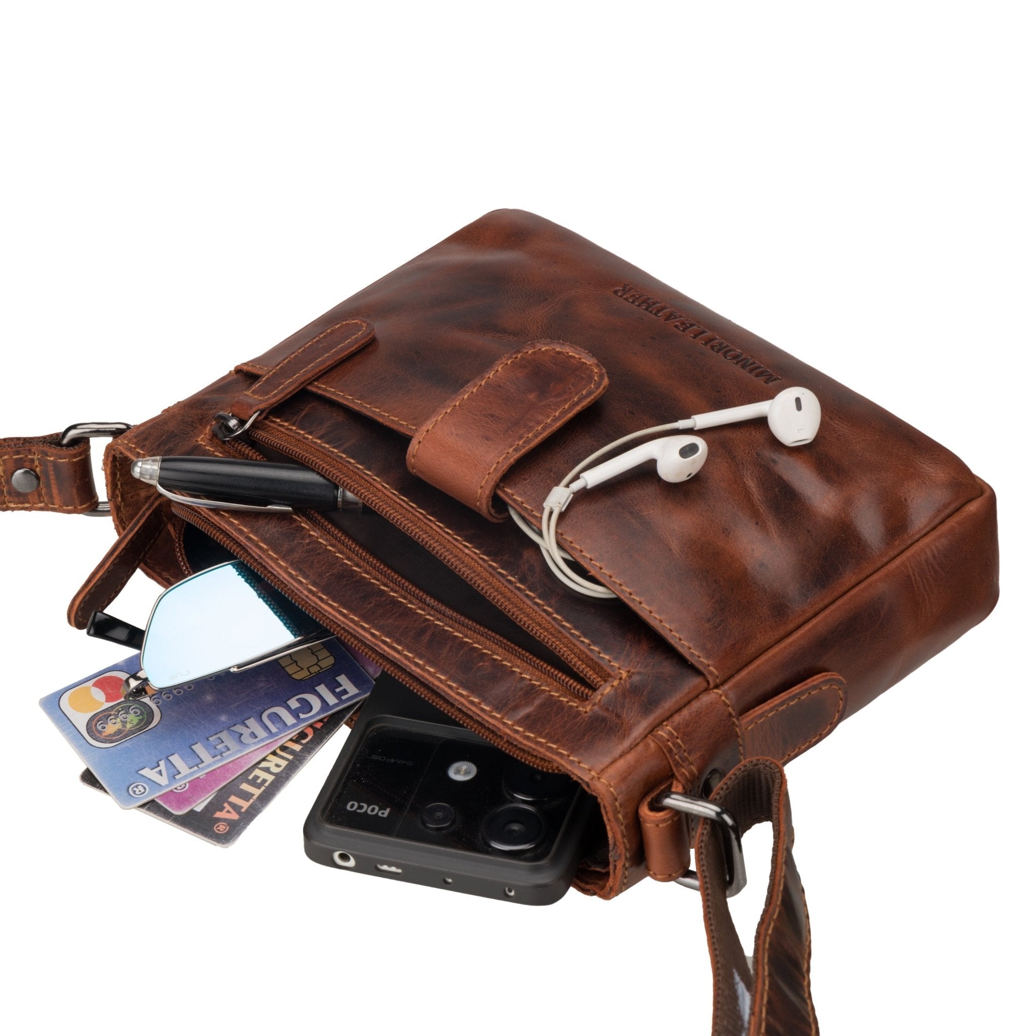 Minori Leather unisex chestnut leather crossbody bag with adjustable strap and sleek design.