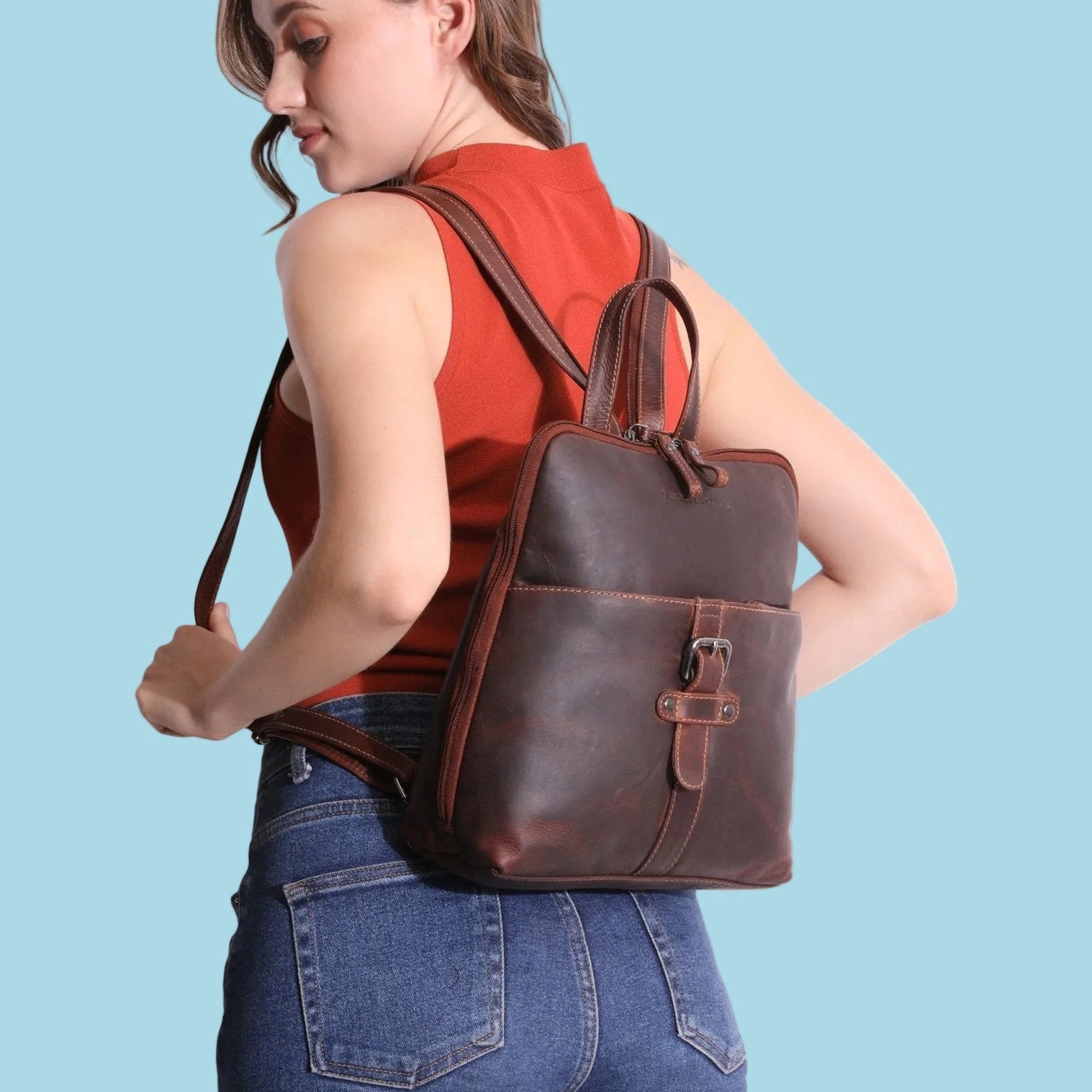 Minori Leather Isla leather backpack for women in chestnut with adjustable straps and spacious interior.