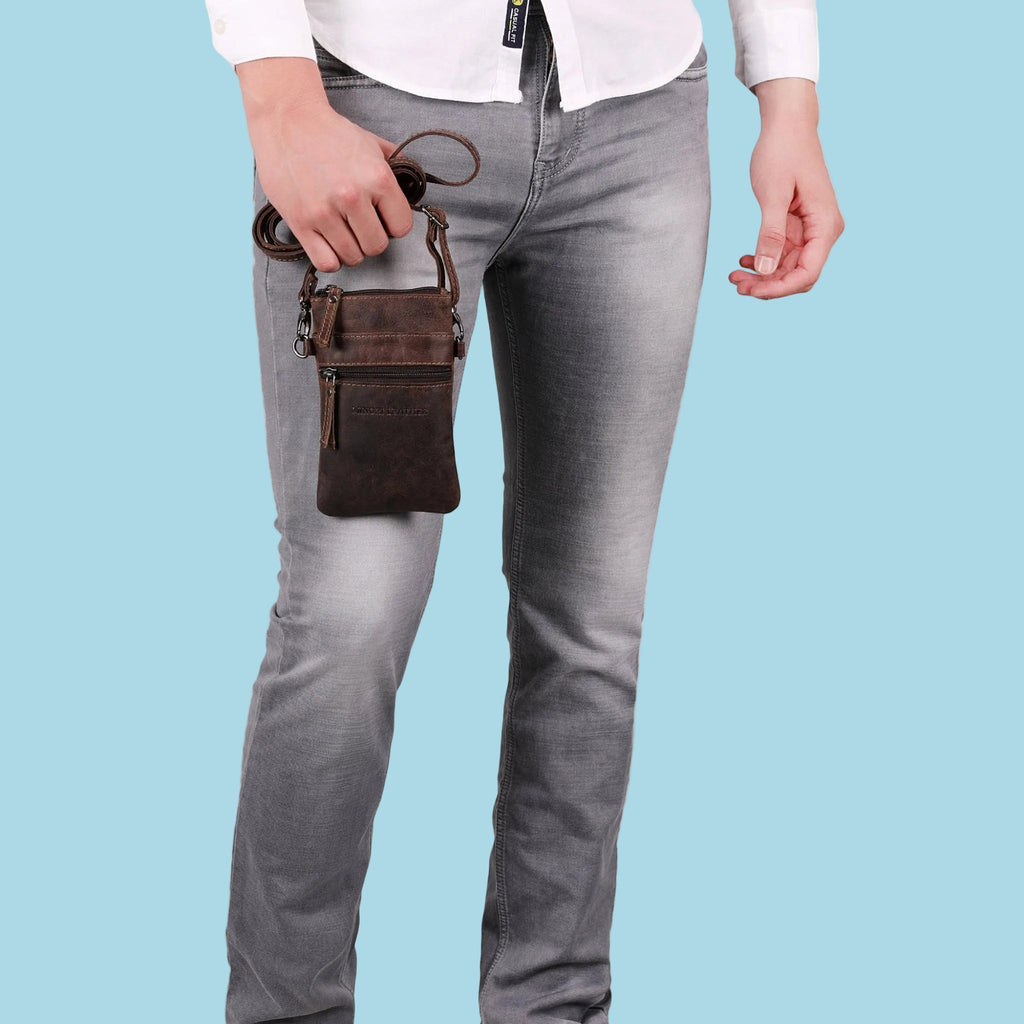 Brown Ashford leather sling bag by Minori Leather, unisex design with adjustable strap and sleek, compact style.