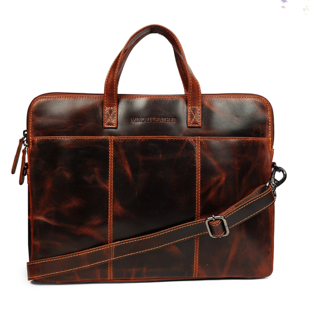 Minori Leather Atlas 14-inch unisex leather laptop sleeve in chestnut, featuring a sleek, protective design with a smooth leather finish.