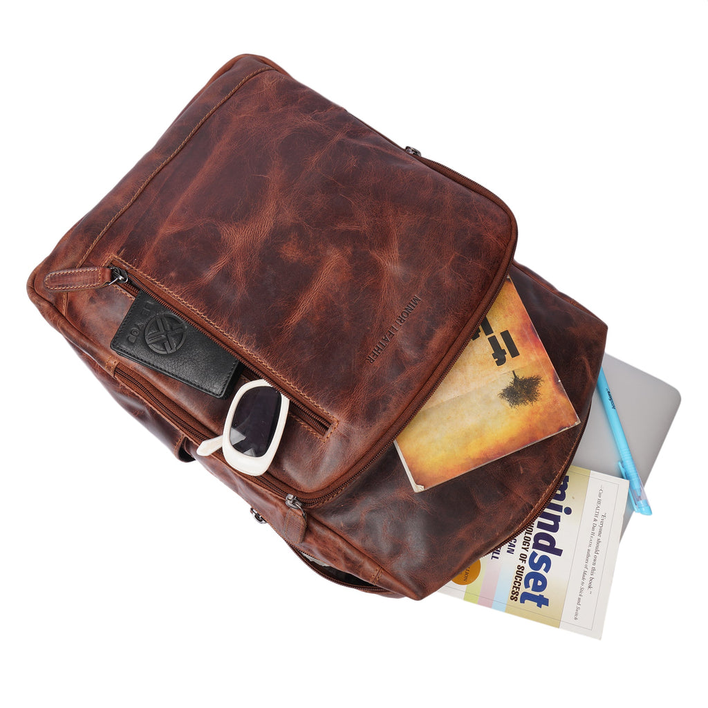 Minori Leather Oslo leather laptop backpack for 15.6-inch laptops, featuring a sleek design with multiple compartments.