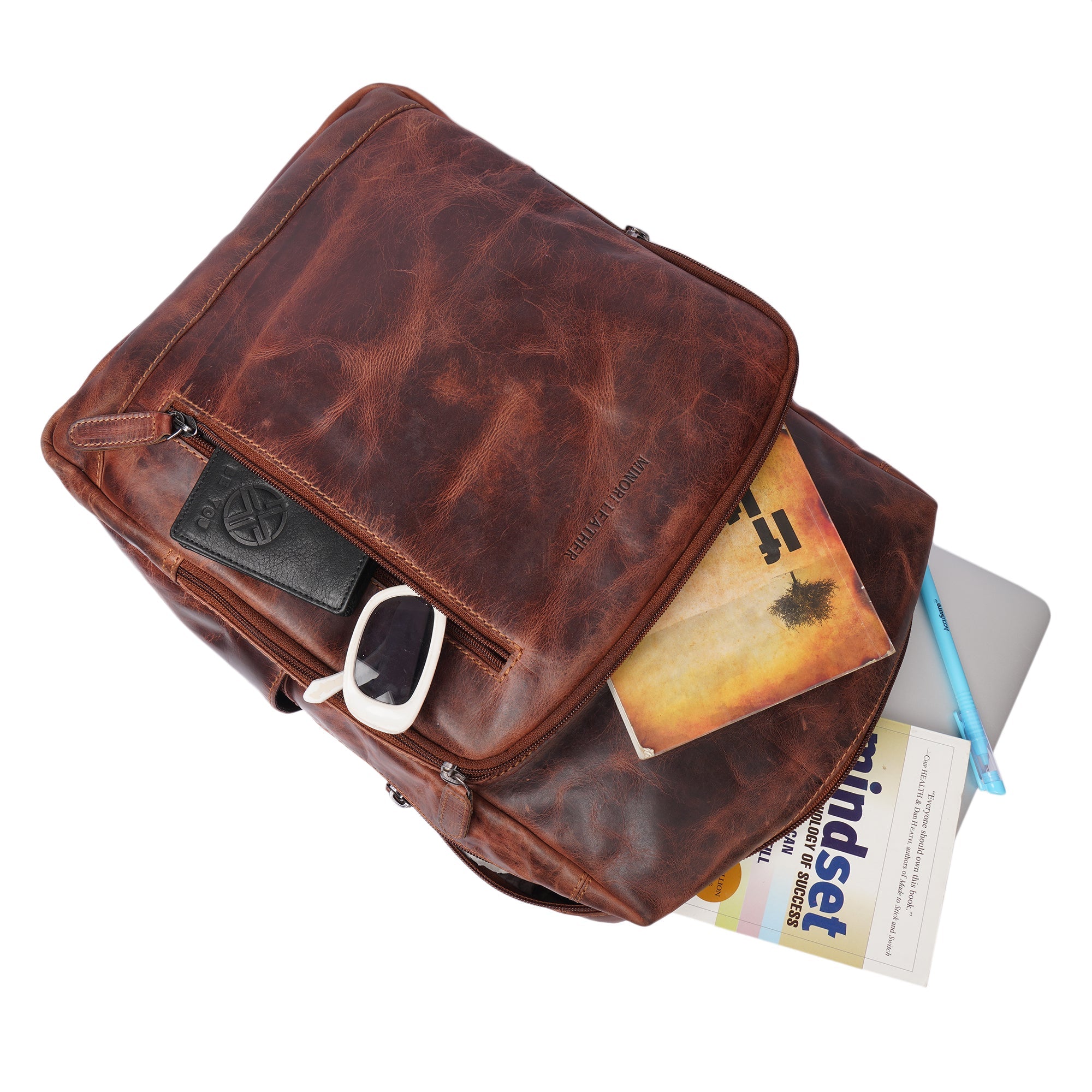 Minori Leather Oslo leather laptop backpack for 15.6-inch laptops, featuring a sleek design with multiple compartments.