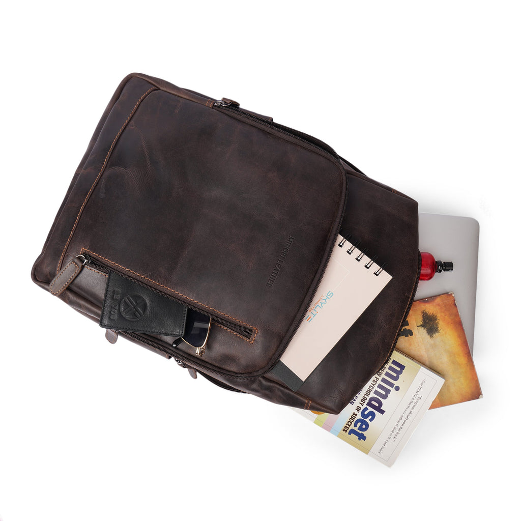 Minori Leather Oslo leather laptop backpack with 15.6-inch compartment, featuring sleek design and durable leather material.