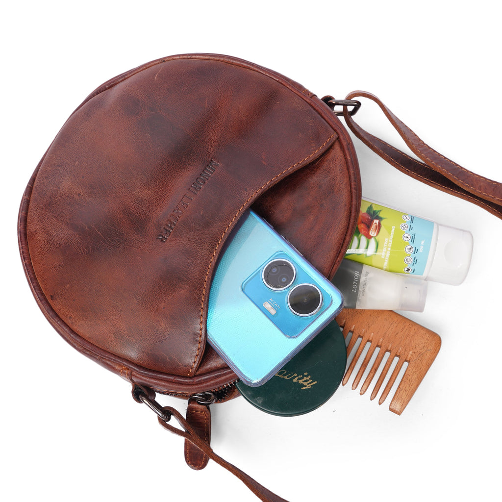 Luna leather round crossbody bag by Minori Leather in chestnut and hair-on brown, featuring a sleek compact design for women.