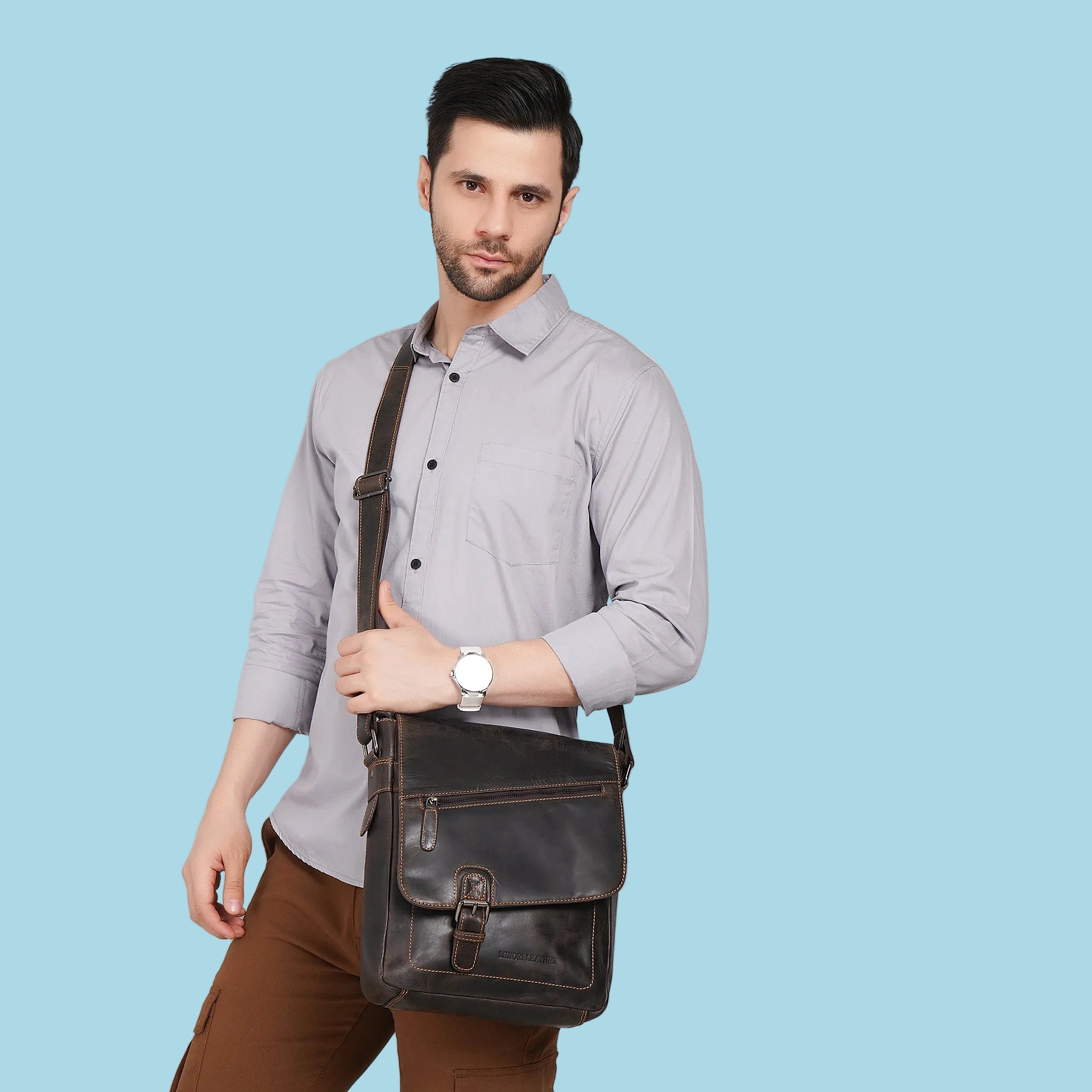 Minori Leather brown leather crossbody satchel bag with adjustable strap and classic design.