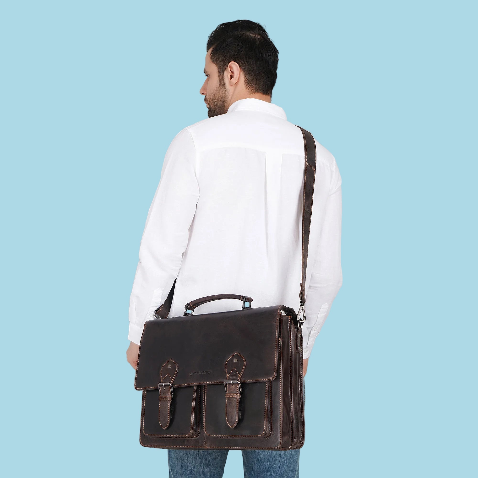 Minori Leather Cambridge leather briefcase bag with sturdy handle, front pocket, and classic design for professional use.