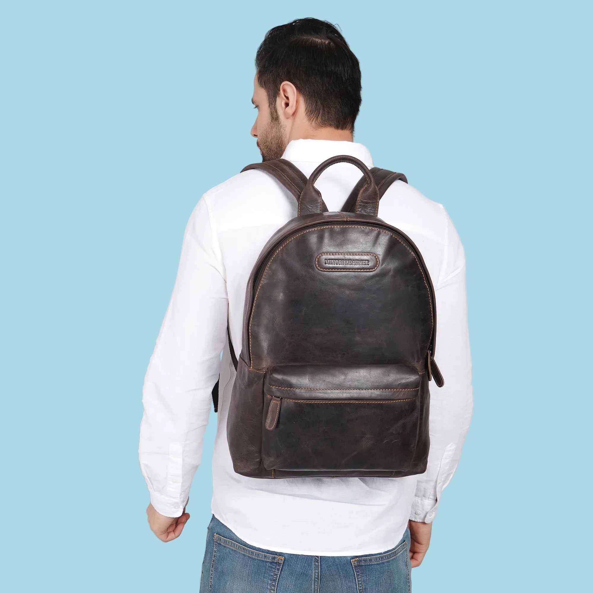 Minori Leather Garth Leather Backpack showing sturdy leather material, adjustable straps, and spacious main compartment.