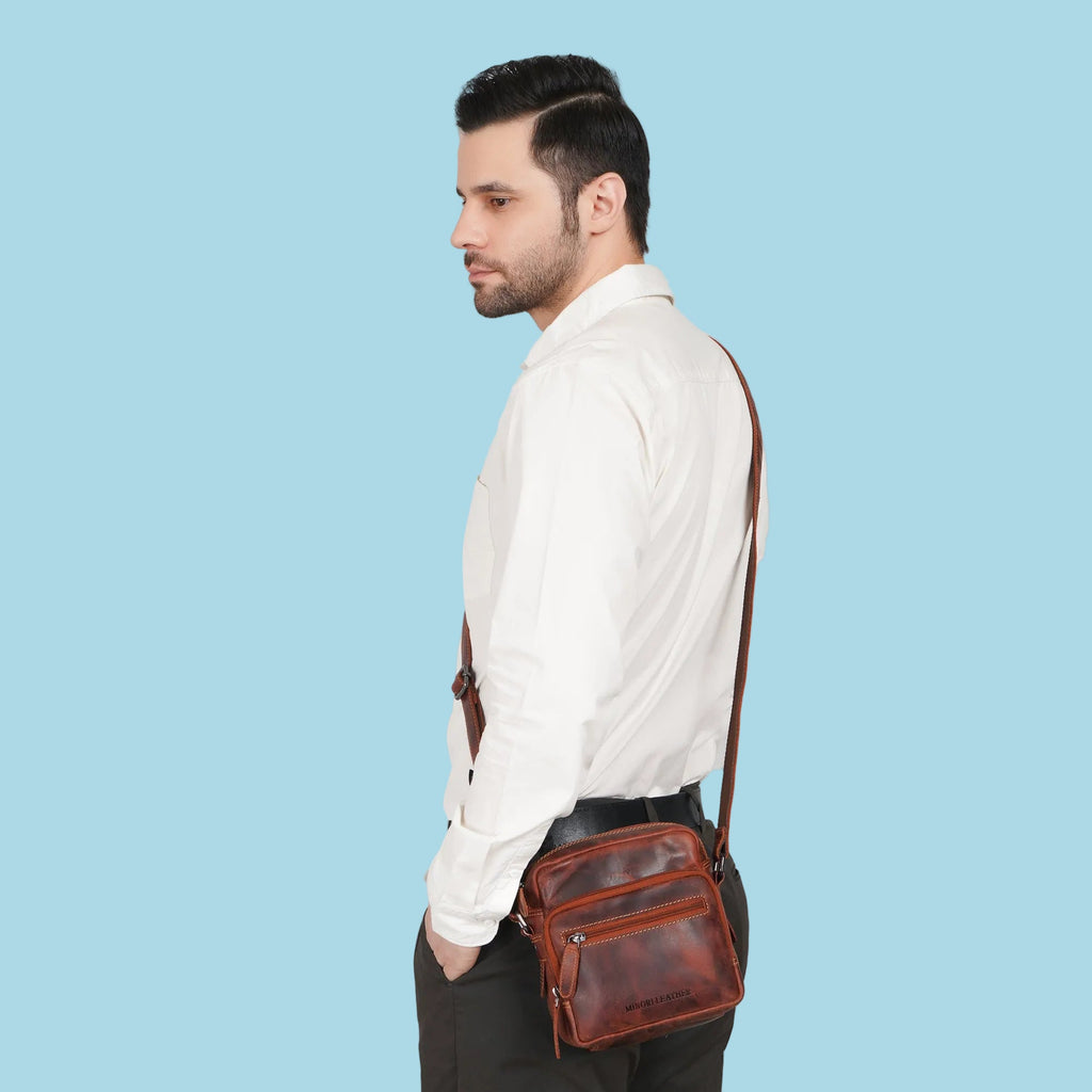 Minori Leather Cove crossbody bag in chestnut leather, featuring a compact design with adjustable strap and minimalist style.