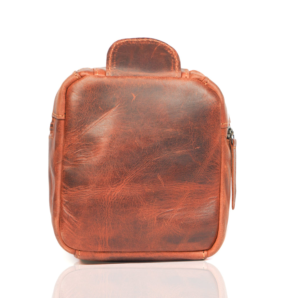 Minori Leather premium chestnut leather toiletry bag for men with multiple compartments and durable handle.