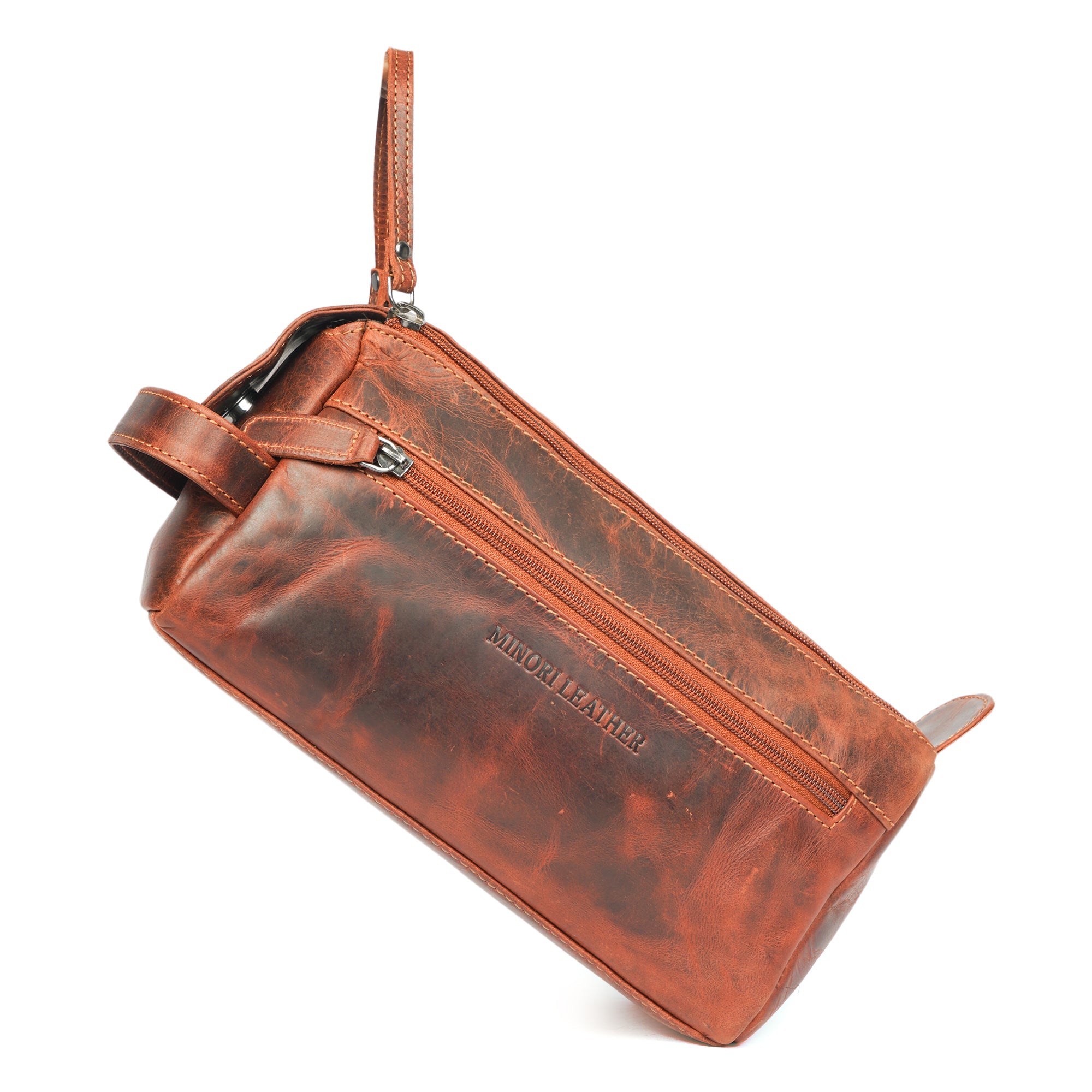 Minori Leather premium chestnut leather toiletry bag for men with organized compartments and sturdy handle.