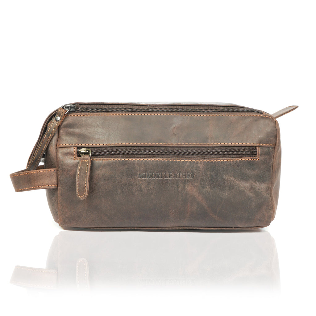 Brown premium leather toiletry bag for men by Minori Leather, featuring a sleek, durable design with multiple compartments.