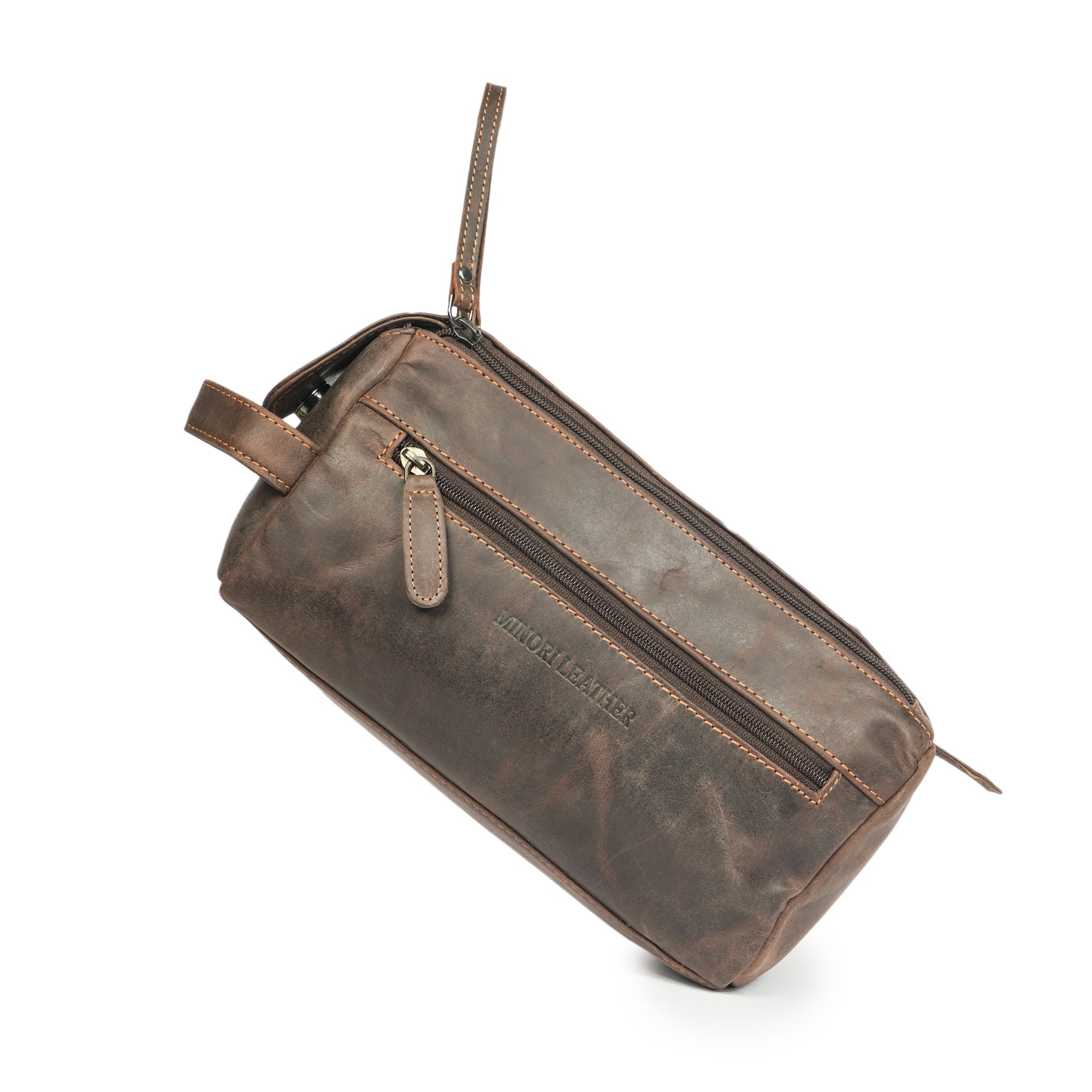 Brown premium leather toiletry bag for men by Minori Leather, featuring a compact and stylish design for travel storage.
