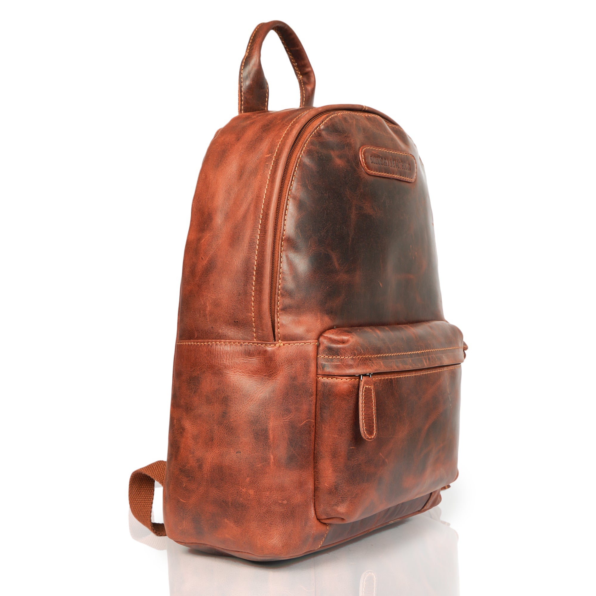 Minori Leather Garth Leather Backpack with adjustable straps and multiple compartments, crafted from smooth brown leather.